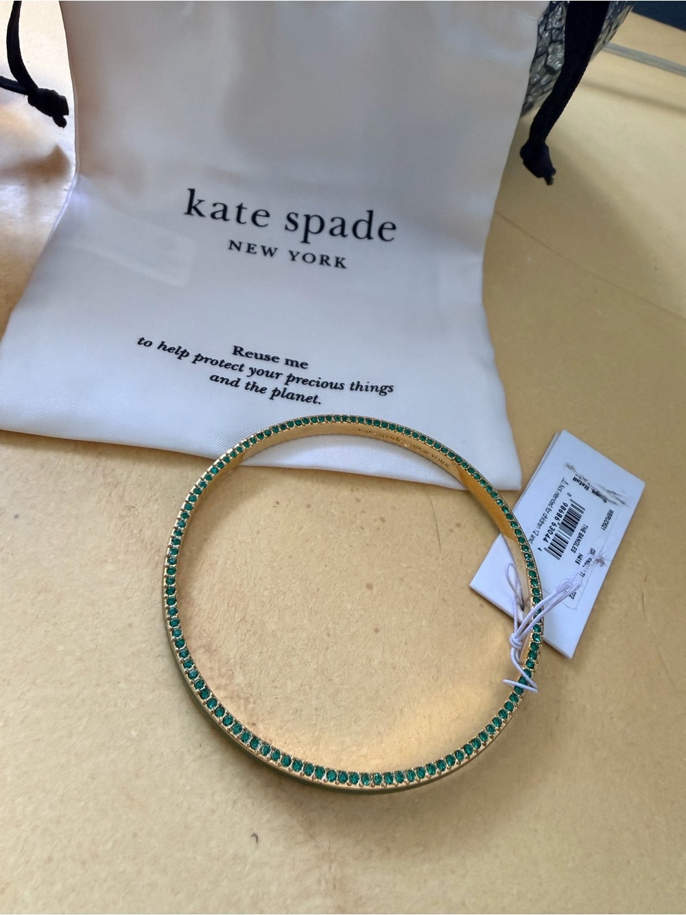 kate spade Gold Tone Ring it Up Bangle with Emerald Green Stones